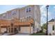 The townhome shows the decks on the second floor extending over the garages at 125 Silvia Ln # 24, Hapeville, GA 30354