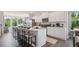 Bright kitchen boasts a large island with seating, stainless steel appliances, and white cabinetry at 125 Silvia Ln # 24, Hapeville, GA 30354