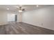 Spacious living room featuring new gray vinyl floors and a modern ceiling fan, perfect for relaxing at 500 Pomona Sw Cir, Atlanta, GA 30315