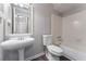 Neat bathroom with white fixtures, pedestal sink, and tiled shower at 1391 Old Coach Sw Rd, Marietta, GA 30008