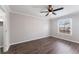 Bright bedroom with hardwood floors, fresh paint, and a spacious closet at 1391 Old Coach Sw Rd, Marietta, GA 30008