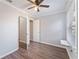 Well-lit room with hardwood floors, ceiling fan and a cozy window cat perch at 1391 Old Coach Sw Rd, Marietta, GA 30008