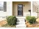 Close up of the front door with small garden beds leading up to it at 1391 Old Coach Sw Rd, Marietta, GA 30008