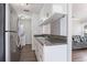 Galley-style kitchen with stainless steel appliances and access to the living room at 1391 Old Coach Sw Rd, Marietta, GA 30008