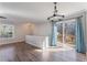 Open and airy dining area with modern chandelier and access to the deck at 1391 Old Coach Sw Rd, Marietta, GA 30008