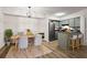 Charming kitchen and dining area featuring modern stainless steel appliances and ample cabinet space at 1923 Brian Way, Decatur, GA 30033