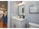 Bathroom featuring a modern vanity with white countertop, black hardware, and stylish decor at 221 Cobb St, Palmetto, GA 30268