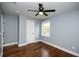 Bright bedroom with hardwood floors, modern fan, and a minimalist aesthetic at 221 Cobb St, Palmetto, GA 30268