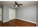 Charming bedroom with hardwood floors, a ceiling fan, and a closet at 221 Cobb St, Palmetto, GA 30268