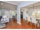 Open layout showing the living room, kitchen and dining area with modern furnishings at 221 Cobb St, Palmetto, GA 30268
