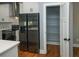 Kitchen showcasing stainless steel appliances and a walk-in pantry with wire shelving at 221 Cobb St, Palmetto, GA 30268