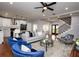 Open-concept living space flows to a modern kitchen with stainless steel appliances and a cozy seating area at 221 Cobb St, Palmetto, GA 30268