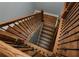 Staircase featuring wood steps, black metal spindles, and a wood handrail at 221 Cobb St, Palmetto, GA 30268