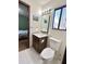 Single sink bathroom featuring tile floors and dark wood cabinets at 3150 Bolero Dr, Atlanta, GA 30341