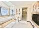 Bright bathroom features a bathtub, shower, fireplace, and stylish decor at 3150 Bolero Dr, Atlanta, GA 30341