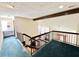 Upstairs hallway with railing and view of the downstairs living space at 3150 Bolero Dr, Atlanta, GA 30341