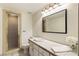 Bright bathroom with tile countertops, a large mirror, and a tiled shower at 1235 Seale Dr, Alpharetta, GA 30022