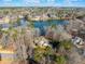 Scenic aerial view of lakefront homes with a lush wooded perimeter and a picturesque, peaceful setting at 210 Lawn Market, Sharpsburg, GA 30277
