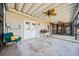 Spacious back porch featuring a fan, tiled patio and doors to the screened-in porch at 210 Lawn Market, Sharpsburg, GA 30277