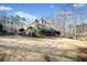 Expansive backyard with a wooden deck, lush greenery and mature trees at 210 Lawn Market, Sharpsburg, GA 30277