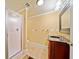 Bathroom with a walk-in shower, a dark wood vanity, and neutral tile flooring at 210 Lawn Market, Sharpsburg, GA 30277