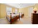 Bright bedroom features two twin beds, carpet floors, and natural light from two windows at 210 Lawn Market, Sharpsburg, GA 30277