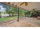 Covered stone patio with a view of the lawn stretching to the lake at 210 Lawn Market, Sharpsburg, GA 30277
