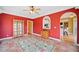 Dining room with a floral rug, wooden furniture and terracotta floor tiles at 210 Lawn Market, Sharpsburg, GA 30277