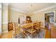 Traditional dining room with hardwood floors, chandelier, and wooden table and chairs at 210 Lawn Market, Sharpsburg, GA 30277