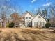 Charming two-story home with stone accents and a well-maintained front yard, perfect for curb appeal at 210 Lawn Market, Sharpsburg, GA 30277