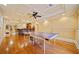 Finished basement area with a ping pong table, hardwood floors, and wet bar at 210 Lawn Market, Sharpsburg, GA 30277