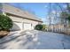 Spacious three-car garage with access to the driveway and access to lake at 210 Lawn Market, Sharpsburg, GA 30277