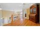 Upstairs hallway features hardwood floors, a staircase and an ornate curio cabinet at 210 Lawn Market, Sharpsburg, GA 30277