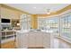 Open kitchen with hardwood floors and large windows at 210 Lawn Market, Sharpsburg, GA 30277