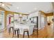 Stylish kitchen with stainless steel appliances, island, and hardwood flooring at 210 Lawn Market, Sharpsburg, GA 30277