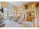 Bright living room with large windows, fireplace, and open floor plan at 210 Lawn Market, Sharpsburg, GA 30277