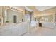 Bright main bathroom featuring a large soaking tub, double vanity, and a private toilet area at 210 Lawn Market, Sharpsburg, GA 30277