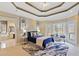 Spacious main bedroom with tray ceiling, lake views, and an ensuite bathroom with tub at 210 Lawn Market, Sharpsburg, GA 30277