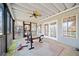 Spacious screened-in porch with outdoor seating and natural light at 210 Lawn Market, Sharpsburg, GA 30277