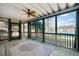Enclosed porch with ceiling fan overlooking the lake offers relaxing views and screened fresh air at 210 Lawn Market, Sharpsburg, GA 30277