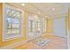 Bright sun room with tile floors, french doors leading outside, and large windows at 210 Lawn Market, Sharpsburg, GA 30277