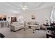 Inviting living room features neutral walls, ceiling fan, and comfortable seating, creating a cozy atmosphere at 235 Tara Woods Dr, Riverdale, GA 30274