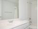 A well-lit bathroom features a white vanity with silver fixtures, complemented by a tub and shower with tiled walls at 3172 Ashford Dunwoody Ne Rd, Brookhaven, GA 30319