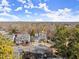 An aerial view of a well-manicured property with a neatly maintained lawn in a serene, wooded neighborhood at 423 Treetop Cir, Canton, GA 30115