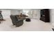 Comfortable finished basement with neutral carpeting, a seating area, and a large television at 423 Treetop Cir, Canton, GA 30115