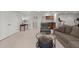 Spacious finished basement with neutral carpeting, a seating area, and a wet bar in the background at 423 Treetop Cir, Canton, GA 30115