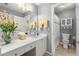 Bathroom with a white vanity, a large mirror, and a shower/tub combo with a curtain at 423 Treetop Cir, Canton, GA 30115