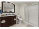 Bathroom featuring a wood vanity with storage, a granite countertop, and a glass enclosed shower at 423 Treetop Cir, Canton, GA 30115