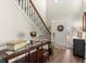 Elegant foyer featuring hardwood floors, a staircase, and a decorative entryway table at 423 Treetop Cir, Canton, GA 30115