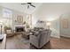 Bright living room with a stone fireplace, vaulted ceilings, and ample seating for entertaining at 423 Treetop Cir, Canton, GA 30115